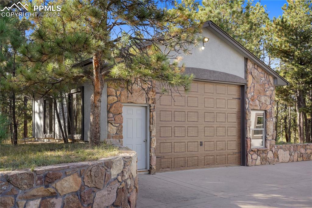 9450 Morgan Road Colorado Springs, CO 80908 - Photo 44 of 49 a brick house with tree in front of it
