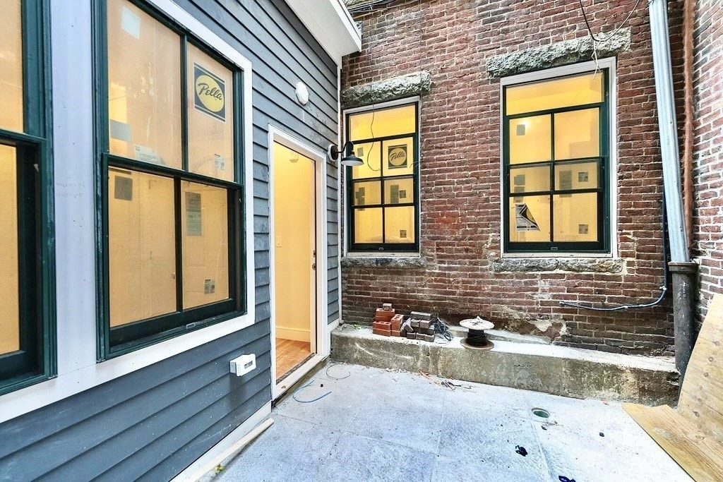 18 Grove Street, Unit 1 Boston, MA 02114 - Photo 11 of 13 a view of front door of house with a street