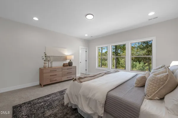 a bed room with a bed and a window