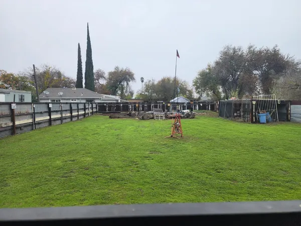 a view of a lake with a garden and trees