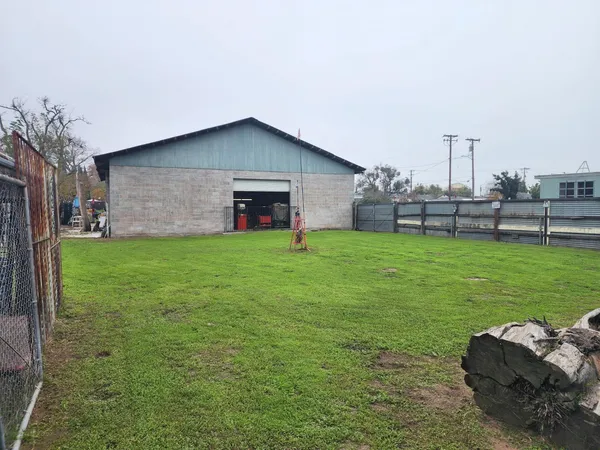 a view of a backyard with a garden and plants