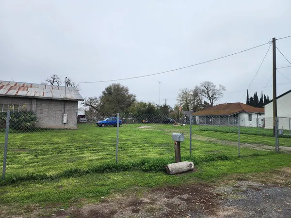 a fire hydrant in the middle of a field
