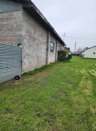 a view of a backyard of the house
