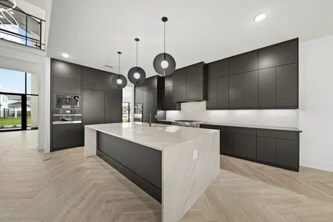 a dining room with furniture and a floor to ceiling window