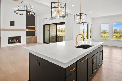 a kitchen with a sink and cabinets