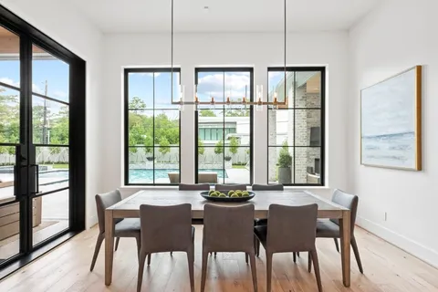a kitchen with granite countertop white cabinets and refrigerator