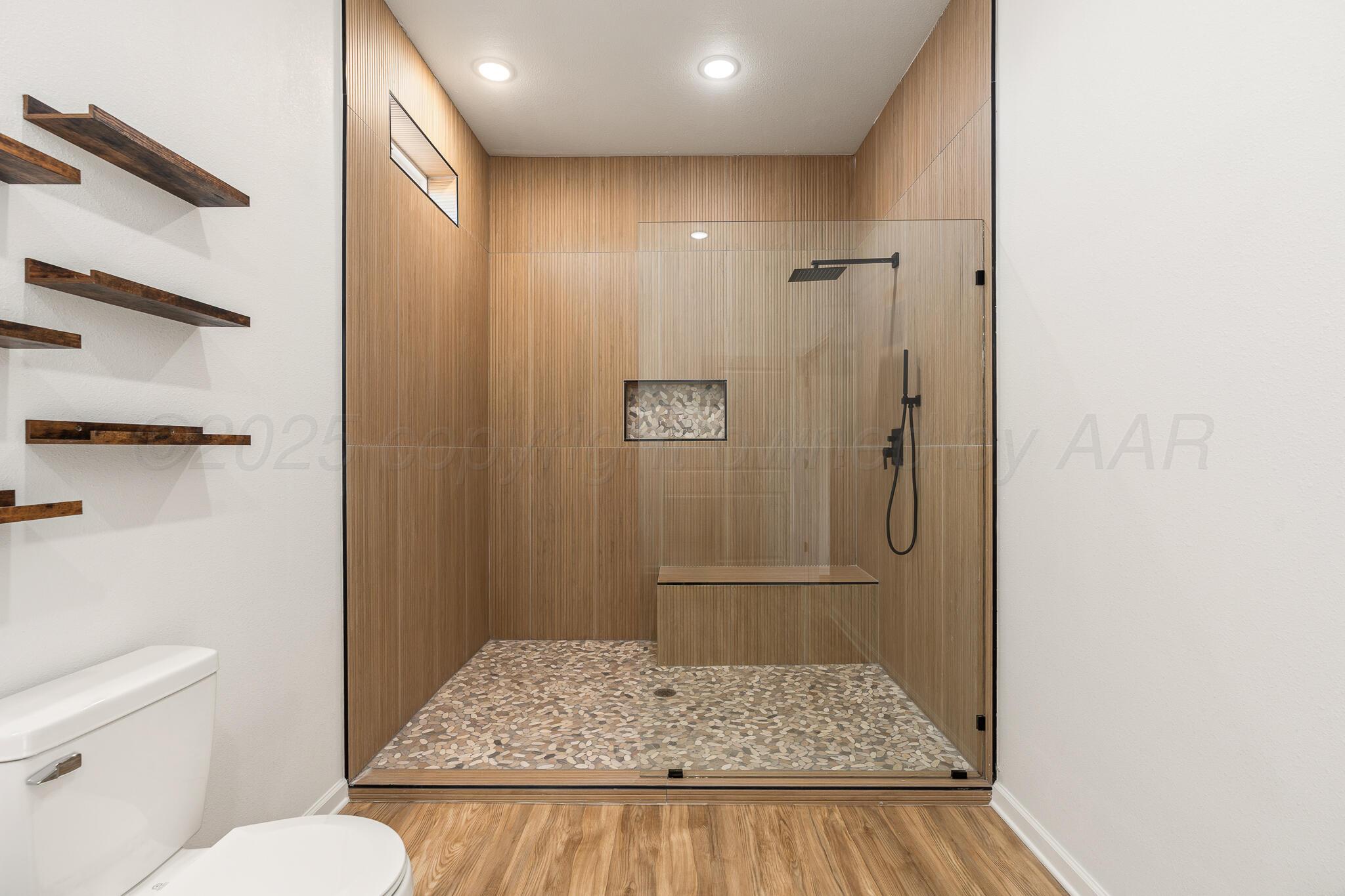220 Sims Street Clarendon, TX 79226 - Photo 12 of 17 a bathroom with a granite countertop sink and a mirror