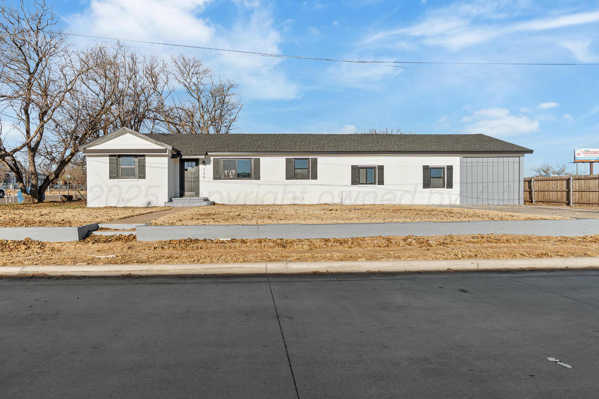 220 Sims Street Clarendon, TX 79226 - Photo 2 of 17 a front view of a house with a yard
