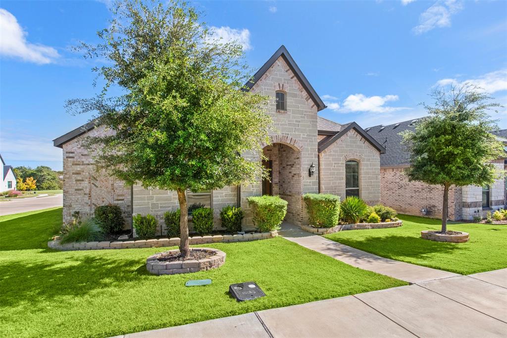 2002 Kati Jane Lane Midlothian, TX 76065 - Photo 2 of 30 a front view of a house with a yard and garage