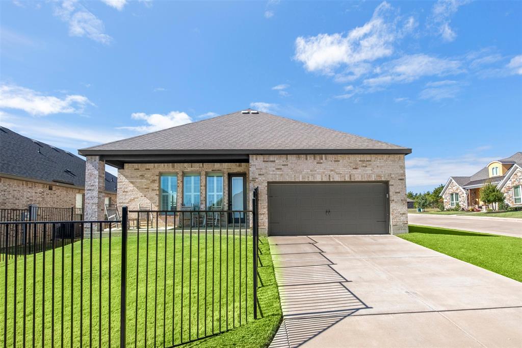 2002 Kati Jane Lane Midlothian, TX 76065 - Photo 30 of 30 a front view of a house with a garden and yard