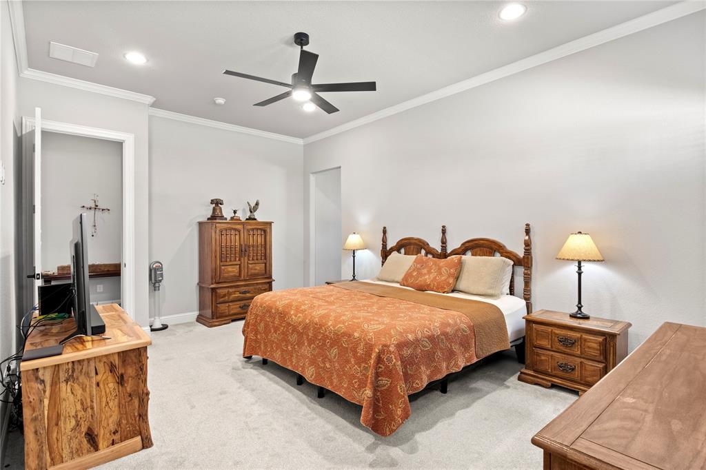 2002 Kati Jane Lane Midlothian, TX 76065 - Photo 7 of 30 a bedroom with a bed and wooden floor