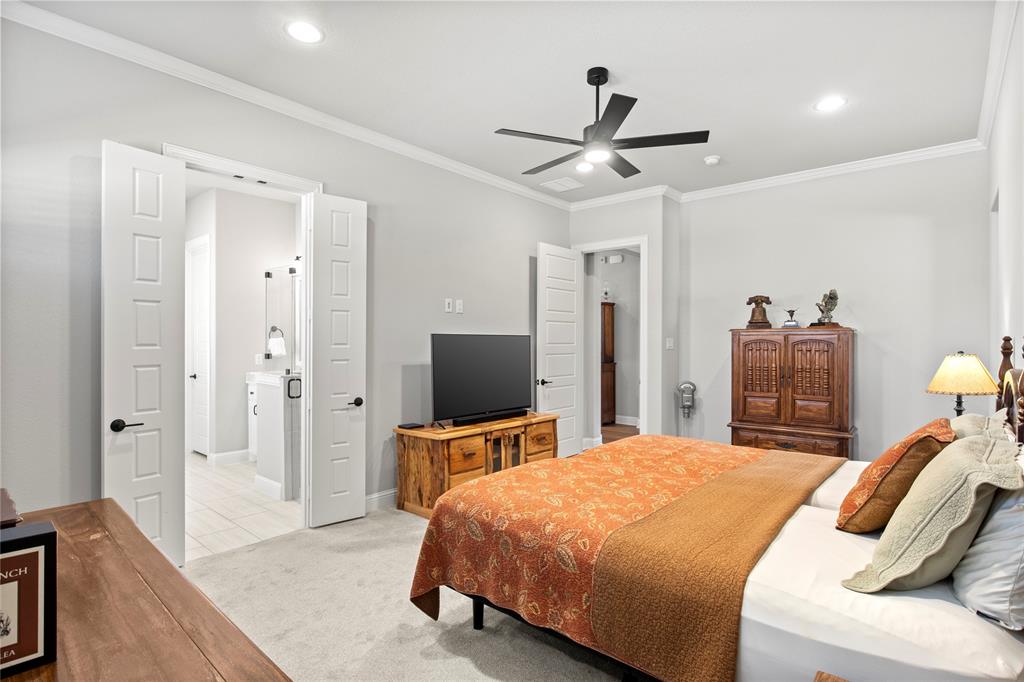 2002 Kati Jane Lane Midlothian, TX 76065 - Photo 8 of 30 a bedroom with a bed and a flat screen tv