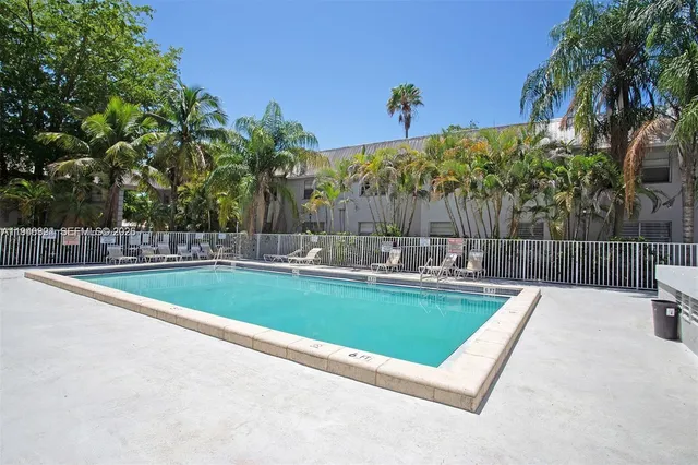 a view of a swimming pool with a patio