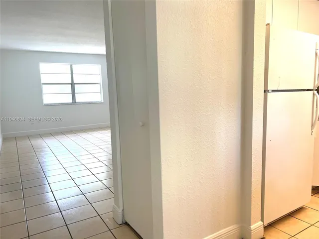 a view of empty room with windows