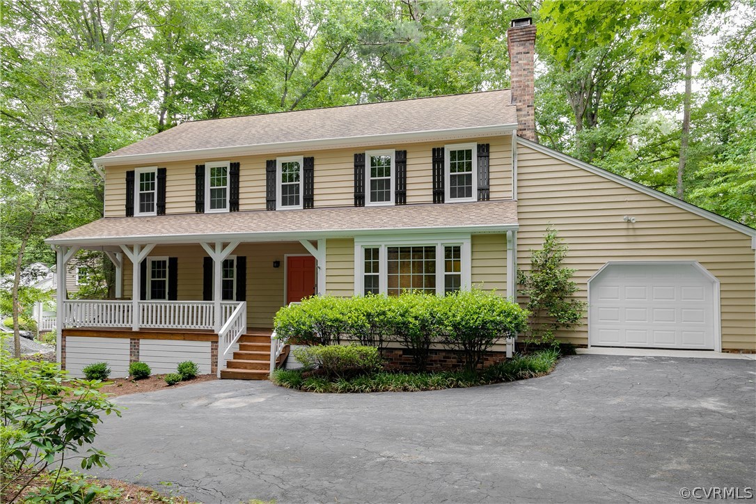 13602 Winterberry Ridge Midlothian, VA 23112 - Photo 2 of 47 a front view of a house with a garden