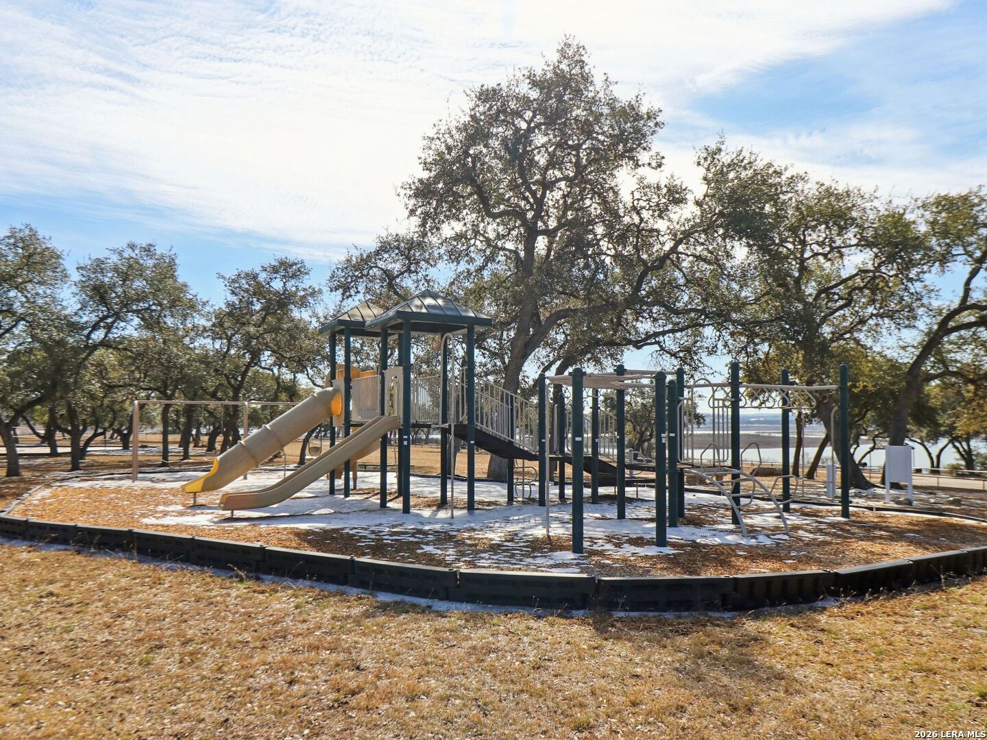 358 Toucan Drive Spring Branch, TX 78070 - Photo 24 of 30 a view of a lake with a large trees