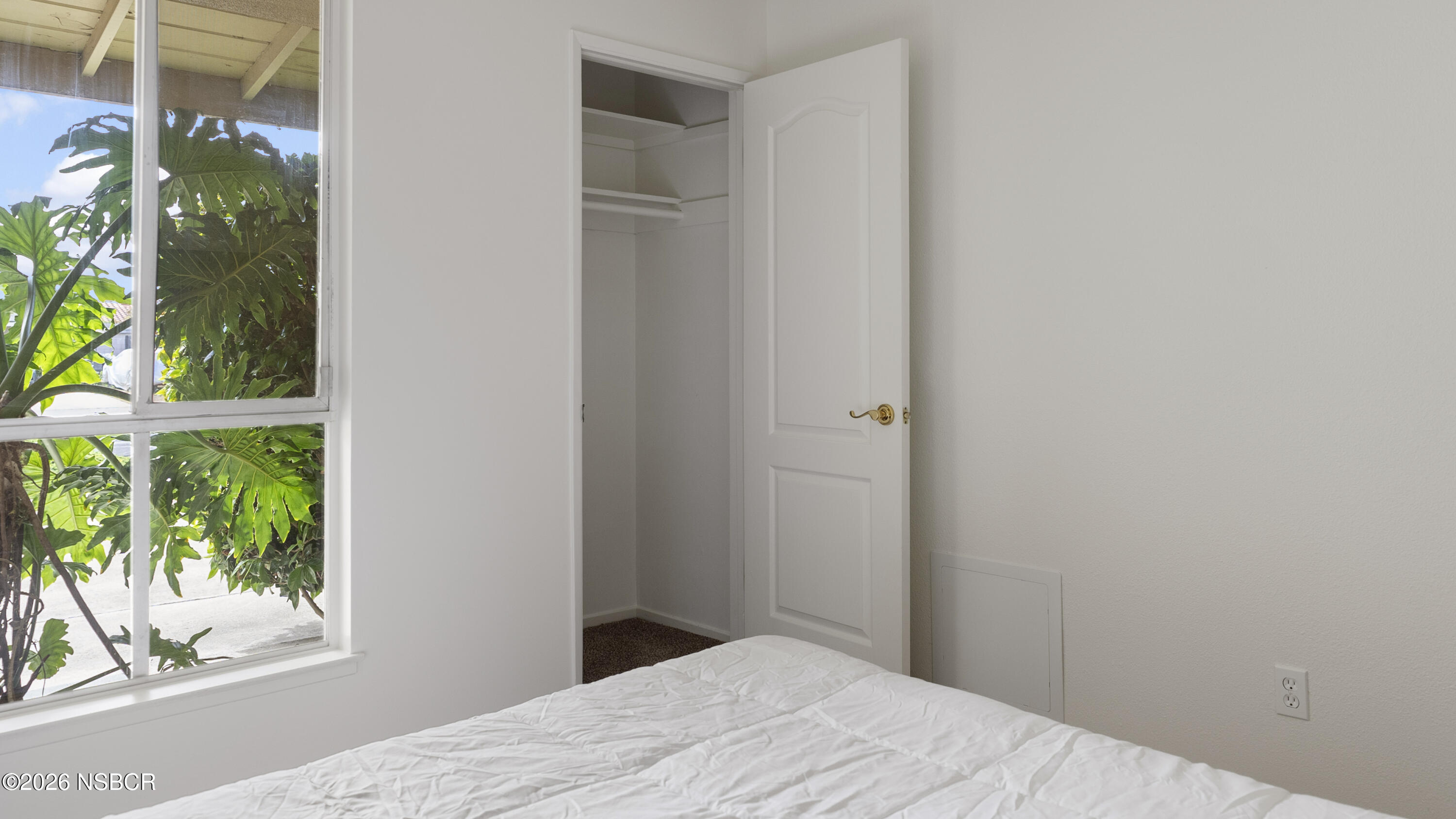 1312 North First Place Lompoc, CA 93436 - Photo 16 of 38 a bedroom with a bed and a window