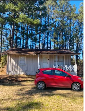 a car parked in front of a house