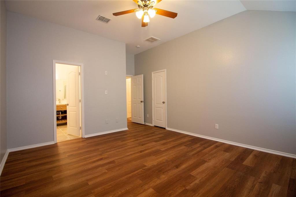 1933 Joe Pool Drive Little Elm, TX 75068 - Photo 11 of 23 wooden floor in an empty room with a window