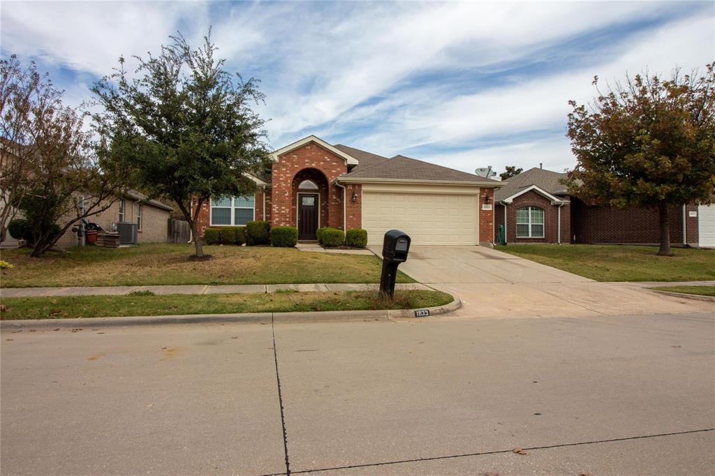 1933 Joe Pool Drive Little Elm, TX 75068 - Photo 2 of 23 a front view of a house with garden