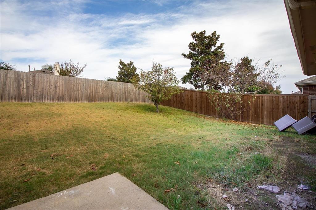 1933 Joe Pool Drive Little Elm, TX 75068 - Photo 20 of 23 a view of a yard with wooden fence