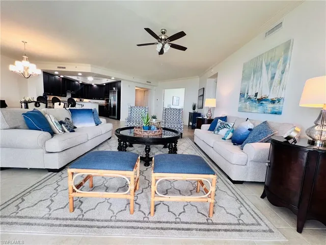 a living room with furniture and a rug