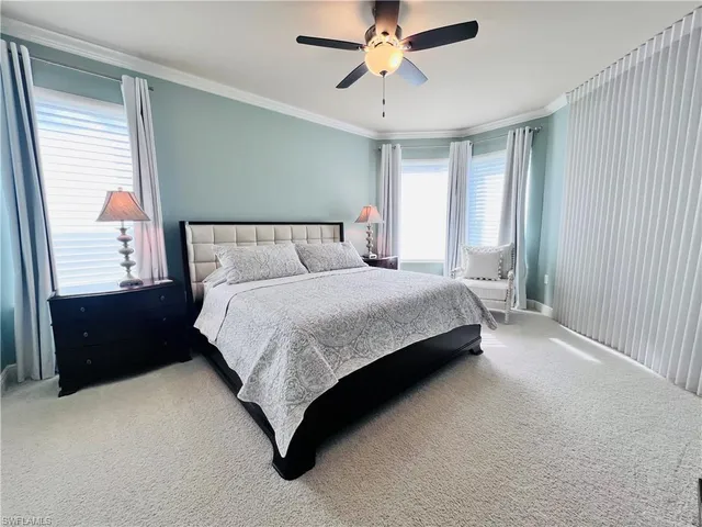 a bedroom with a bed dresser and a window