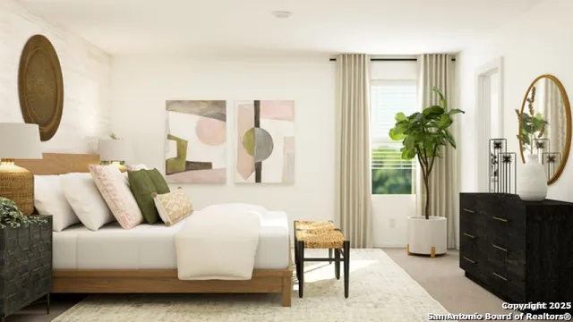 a bedroom with furniture and a potted plant