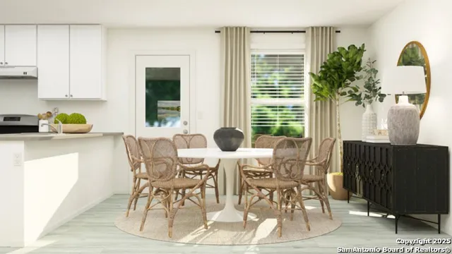 a view of a dining room with furniture and window