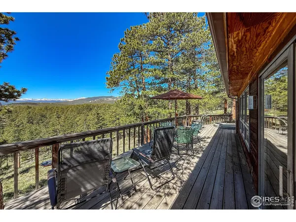 a view of balcony with wooden floor and lake view