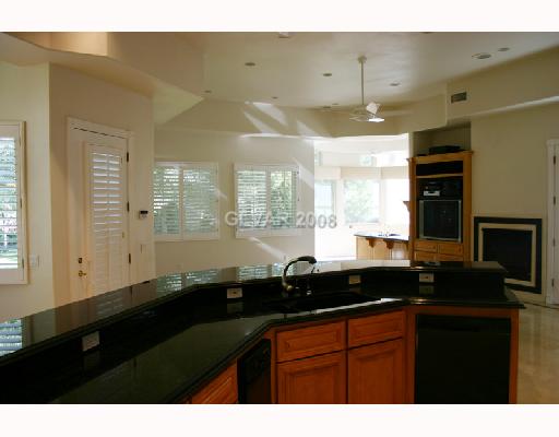 173 Inveraray Court Henderson, NV 89074 - Photo 5 of 11 Kitchen. Kitchen over looks family room, back yard and golf course.