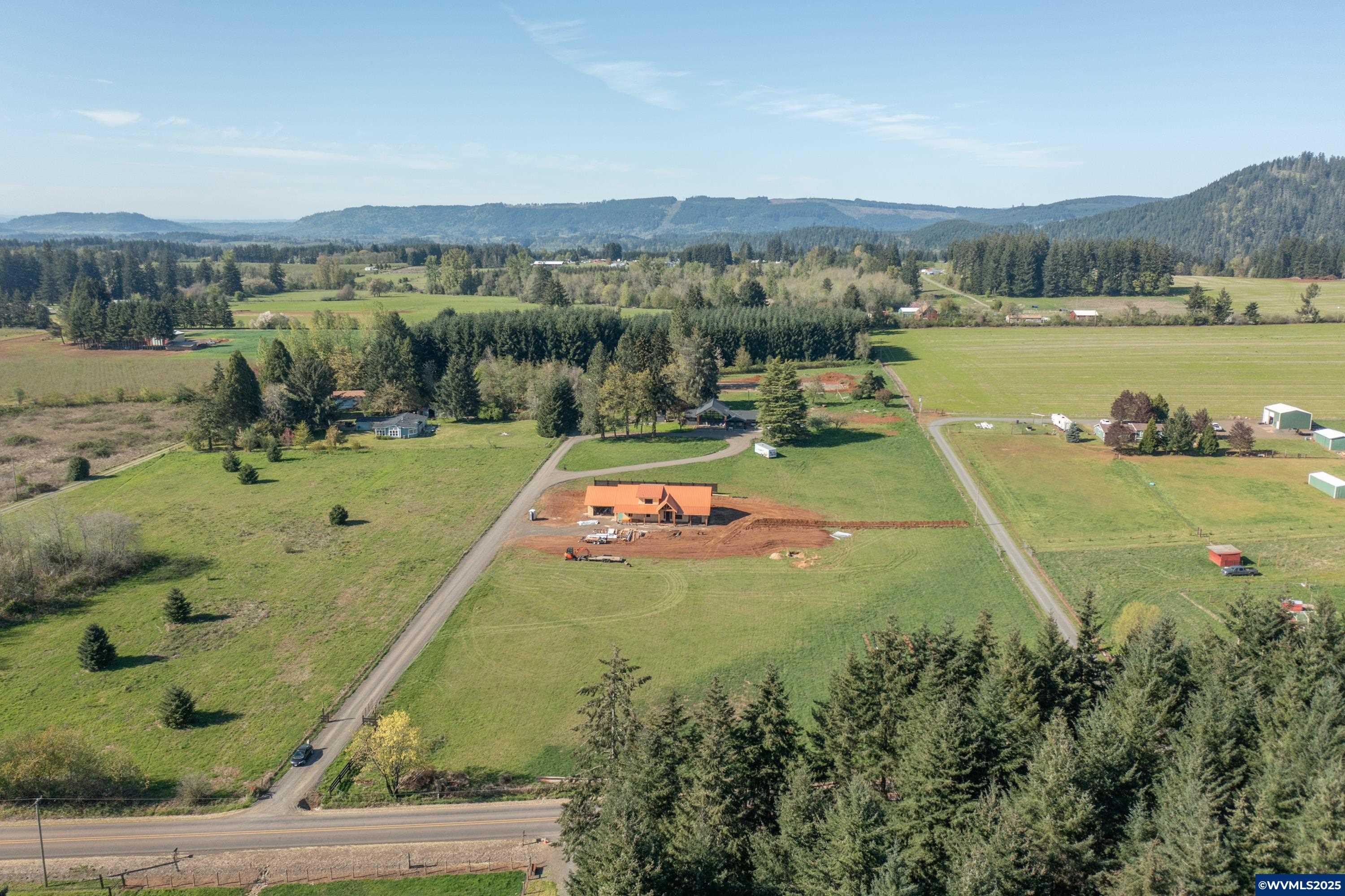 34198 East Lacomb Road Lebanon, OR 97355 - Photo 11 of 11 a view of a swimming pool and mountains in the background