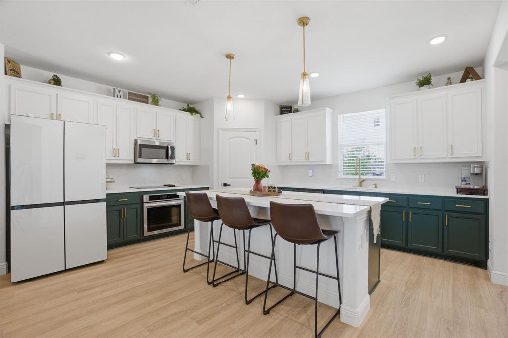773 Pennell Road Sherman, TX 75090 - Photo 8 of 29 One of the prettiest kitchens you'll ever see! The sellers customized the look with painted cabinets + gold hardware & pendant lights. Just bring your own refrigerator.