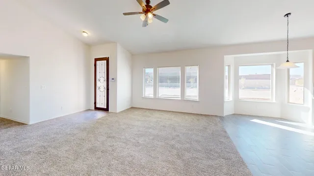 a view of an empty room with a window