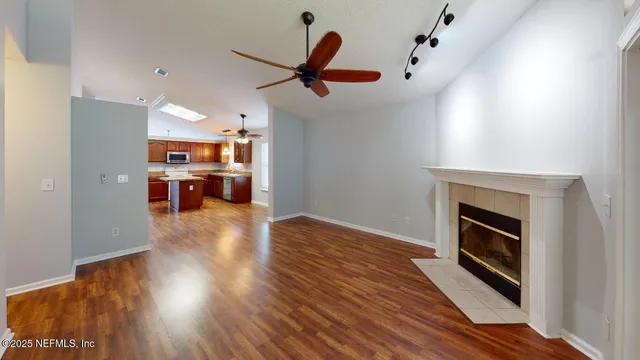 a view of kitchen and kitchen with wooden floor