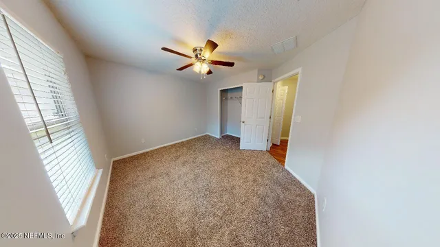 a view of empty room with windows
