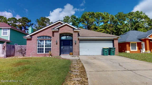 front view of a house with a yard
