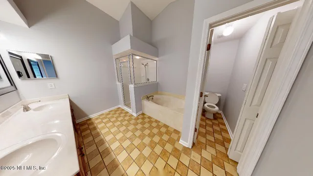 a bedroom with a bed and a rug