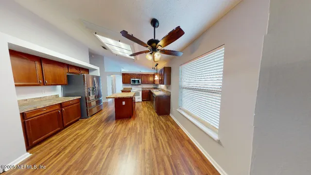 a kitchen with stainless steel appliances granite countertop lots of counter top space