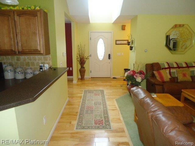 3799 Charles Huff Road Howell, MI 48855 - Photo 9 of 24 LOOKING TOWARDS FOYER/HDWD FLOOR