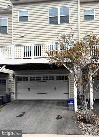 a front view of a house with a garage