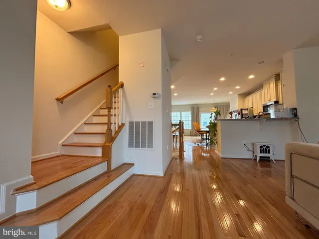 a view of a living room and kitchen with furniture