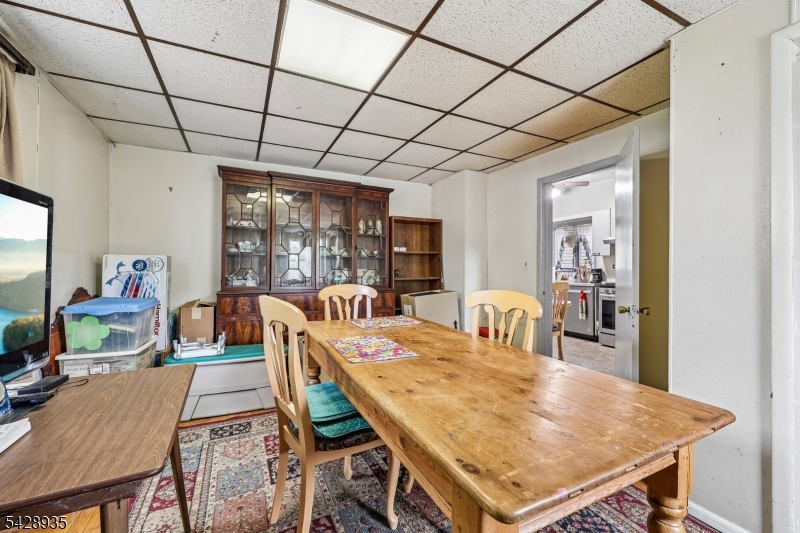 50 Preston Street Ridgefield Park, NJ 07660 - Photo 12 of 41 a dining room with a table chairs and wooden floor