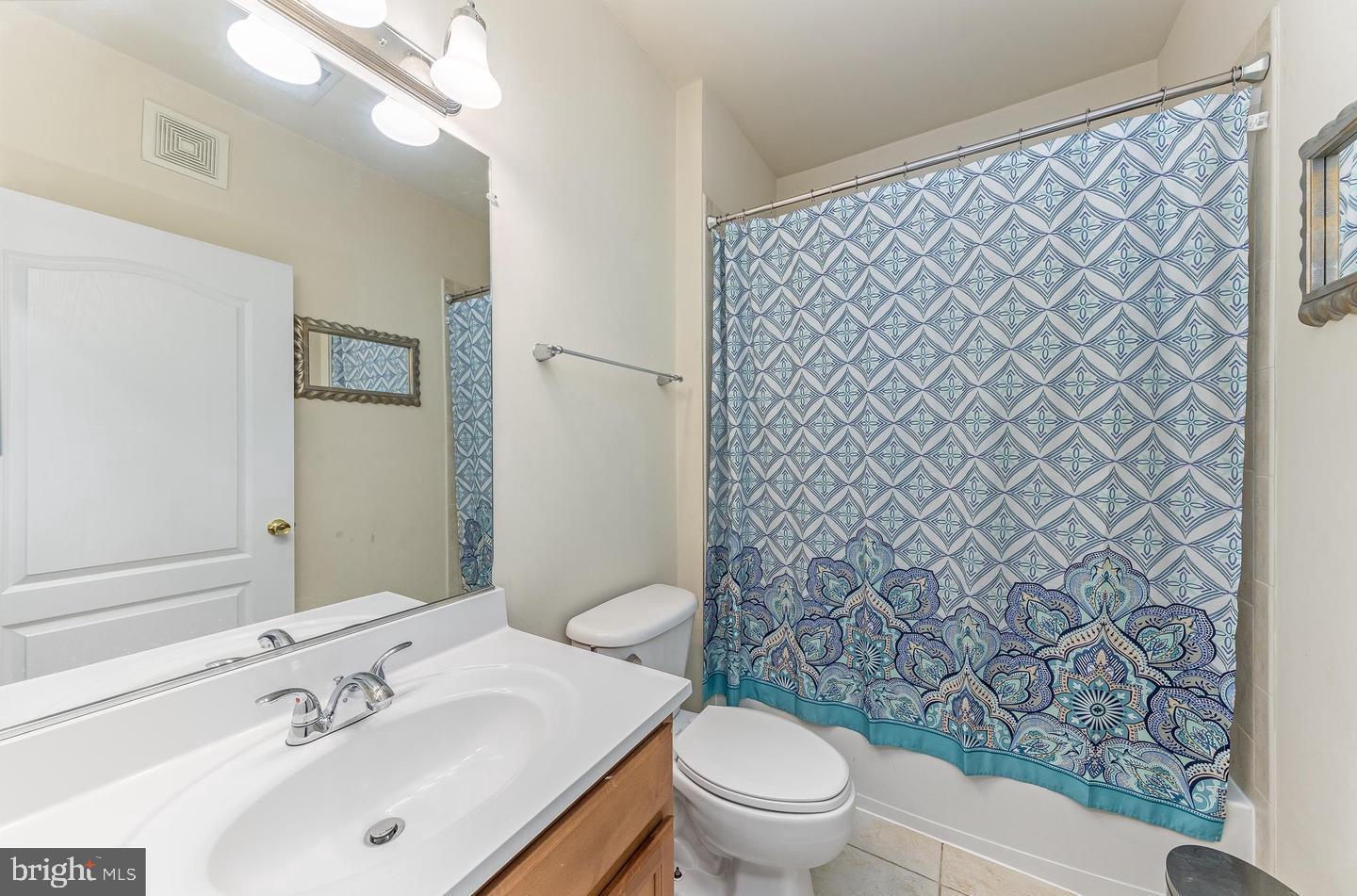 9713 Handerson Place, Unit 304 Manassas Park, VA 20111 - Photo 13 of 14 a bathroom with a sink and a toilet