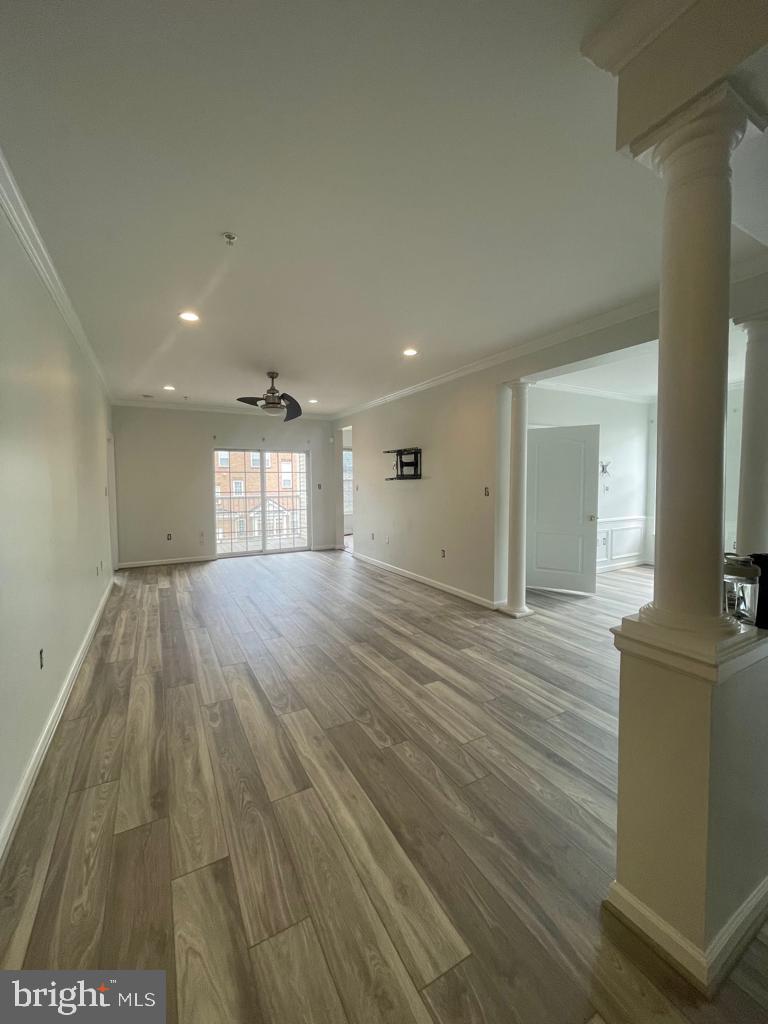 9713 Handerson Place, Unit 304 Manassas Park, VA 20111 - Photo 2 of 14 a view of empty room with wooden floor