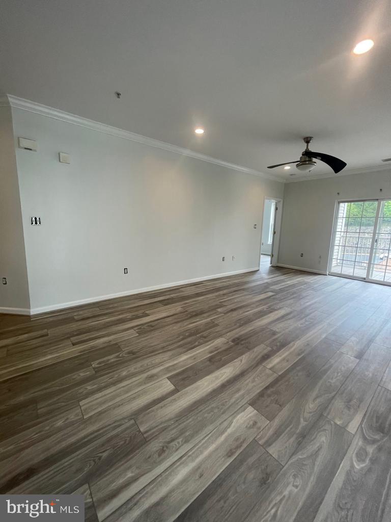 9713 Handerson Place, Unit 304 Manassas Park, VA 20111 - Photo 9 of 14 a view of a livingroom with wooden floor