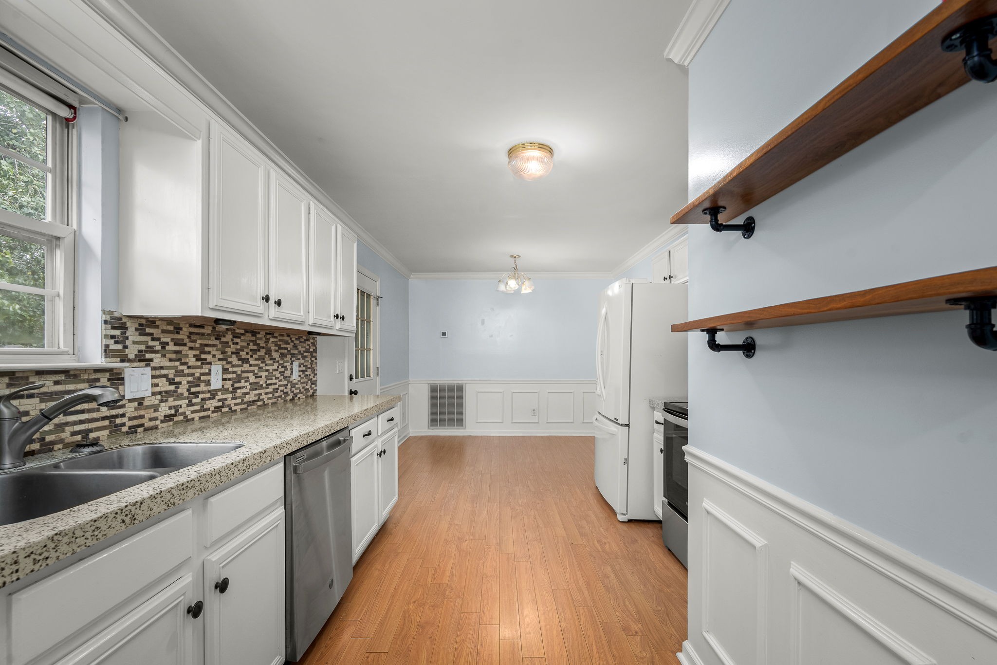 2403 Medford Campbell Boulevard Murfreesboro, TN 37127 - Photo 17 of 35 a kitchen with a sink a refrigerator and window
