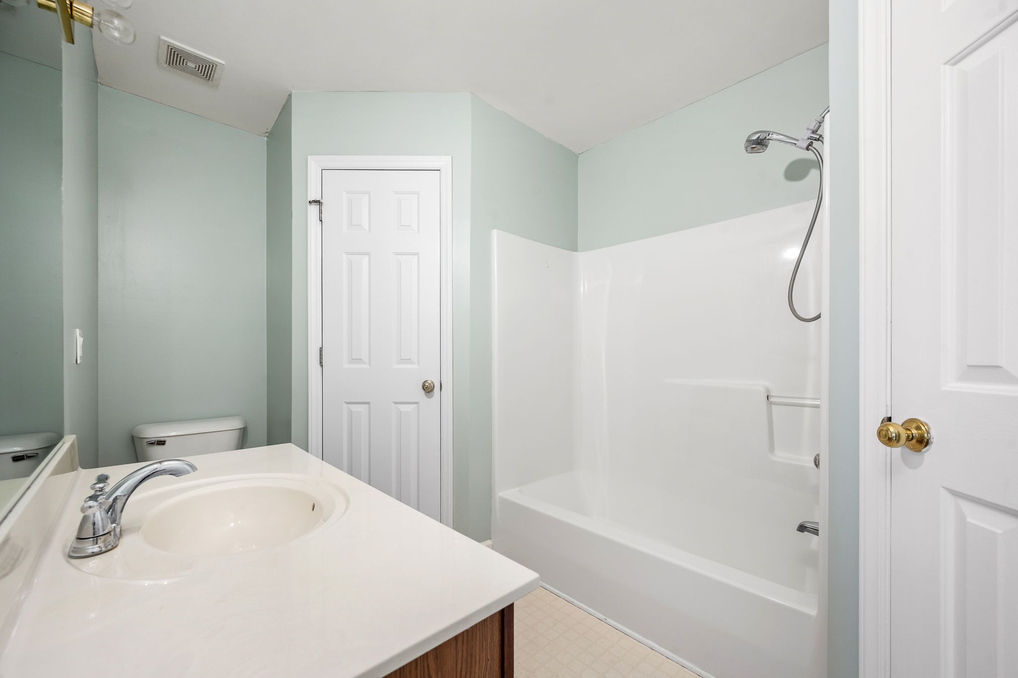 2403 Medford Campbell Boulevard Murfreesboro, TN 37127 - Photo 20 of 35 a bathroom with a white bathtub a shower and a sink