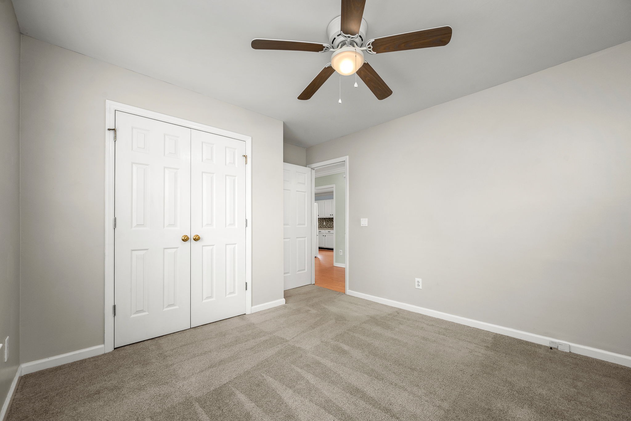 2403 Medford Campbell Boulevard Murfreesboro, TN 37127 - Photo 23 of 35 an empty room with closet and a chandelier fan