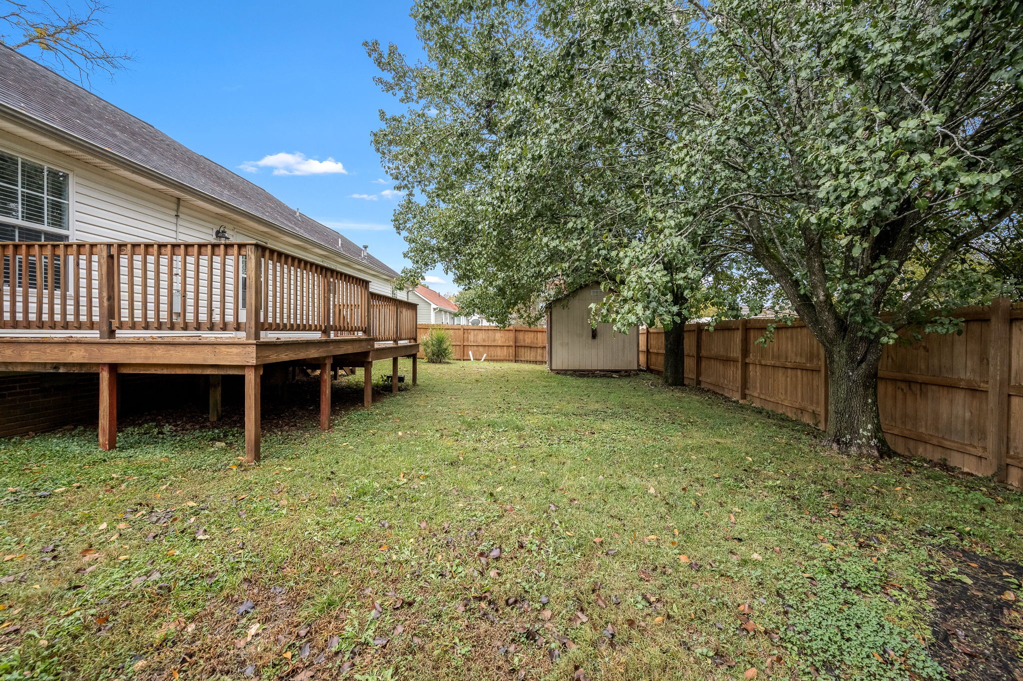 2403 Medford Campbell Boulevard Murfreesboro, TN 37127 - Photo 35 of 35 a backyard of a house with yard and trampoline